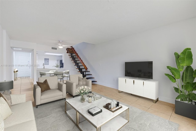 1121 SW 105th Ave Unit 302, Miami, FL 33174 - tiled living room with stairs, ceiling fan, and baseboards