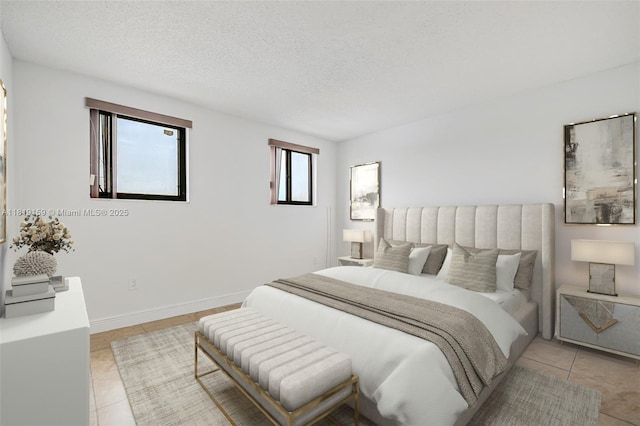 1121 SW 105th Ave Unit 302, Miami, FL 33174 - bedroom with light tile patterned floors and a textured ceiling