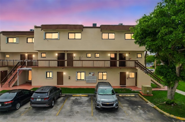 1121 SW 105th Ave Unit 302, Miami, FL 33174 - townhome / multi-family property with stairs, uncovered parking, and stucco siding