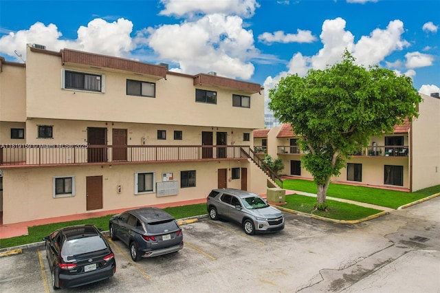 1121 SW 105th Ave Unit 302, Miami, FL 33174 - view of building exterior featuring uncovered parking