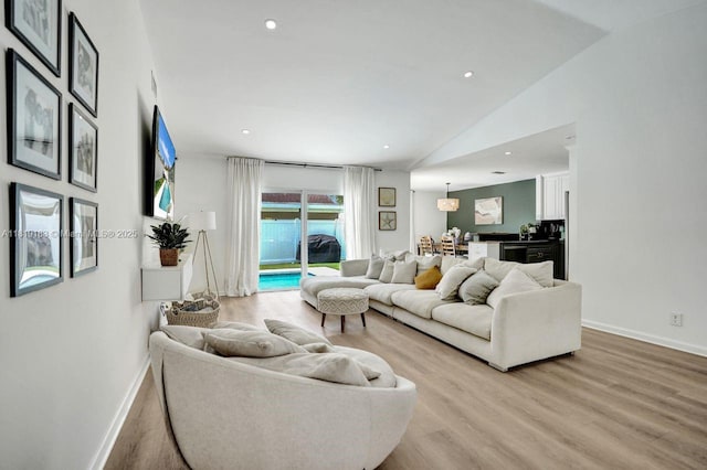 18998 Cloud Lake Cir, Boca Raton, FL 33496 - living area featuring light wood-style floors, vaulted ceiling, and recessed lighting