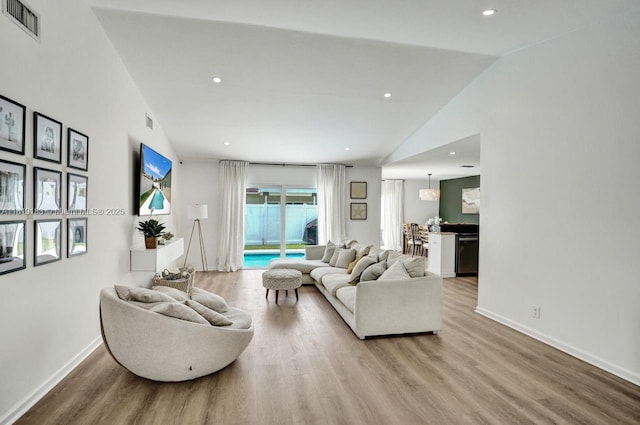 18998 Cloud Lake Cir, Boca Raton, FL 33496 - living area featuring wood finished floors, lofted ceiling, and recessed lighting