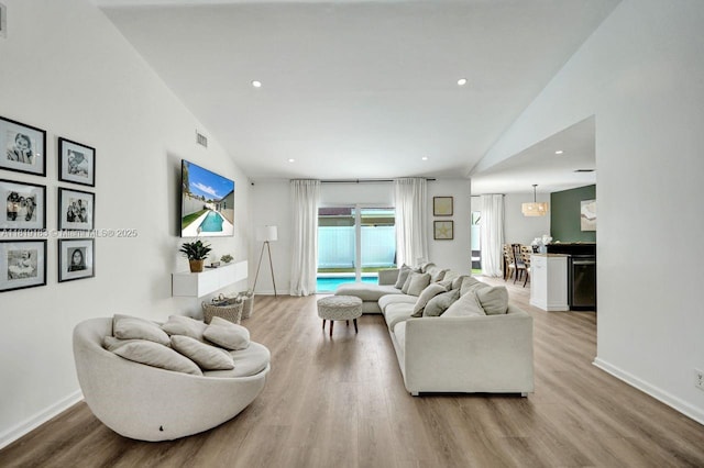 18998 Cloud Lake Cir, Boca Raton, FL 33496 - living area with wood finished floors, lofted ceiling, and recessed lighting