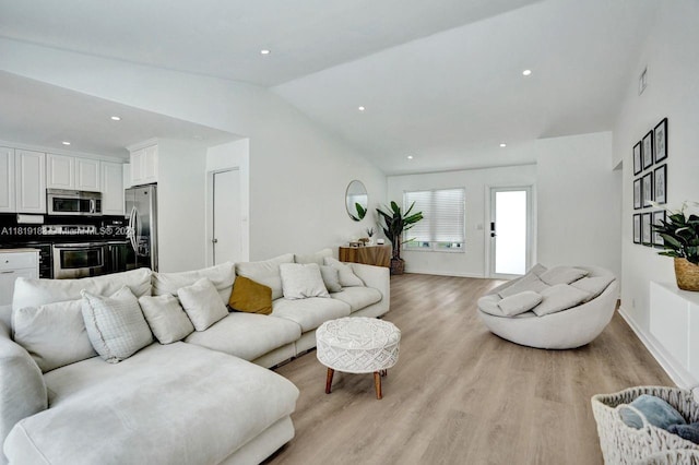 18998 Cloud Lake Cir, Boca Raton, FL 33496 - living area featuring lofted ceiling, light wood-style flooring, and recessed lighting