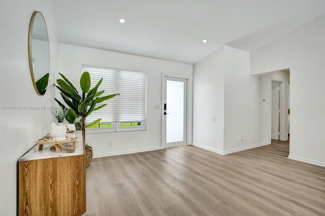 18998 Cloud Lake Cir, Boca Raton, FL 33496 - entryway featuring light wood-type flooring, recessed lighting, and vaulted ceiling