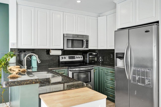 18998 Cloud Lake Cir, Boca Raton, FL 33496 - kitchen with appliances with stainless steel finishes, white cabinetry, a peninsula, tasteful backsplash, and recessed lighting
