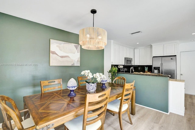 18998 Cloud Lake Cir, Boca Raton, FL 33496 - dining area featuring light wood-style flooring