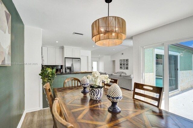 18998 Cloud Lake Cir, Boca Raton, FL 33496 - dining room featuring healthy amount of natural light, light wood-style floors, and recessed lighting