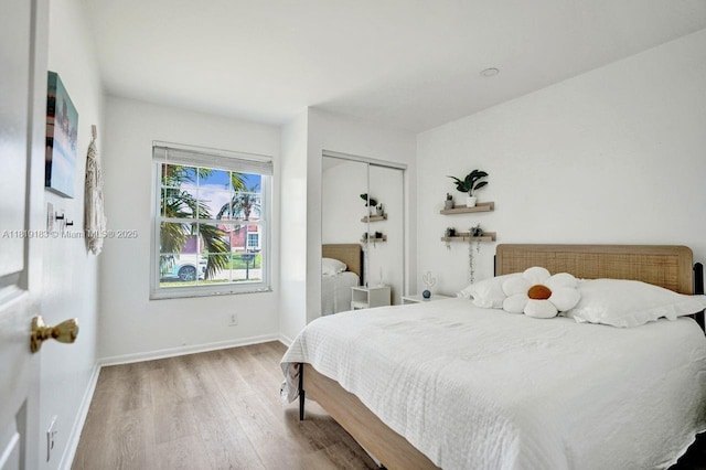 18998 Cloud Lake Cir, Boca Raton, FL 33496 - bedroom featuring wood finished floors and a closet