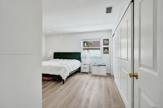 18998 Cloud Lake Cir, Boca Raton, FL 33496 - bedroom featuring light wood-style floors and a closet