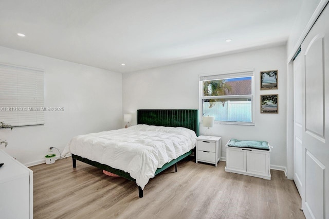 18998 Cloud Lake Cir, Boca Raton, FL 33496 - bedroom with light wood-style floors, a closet, and recessed lighting