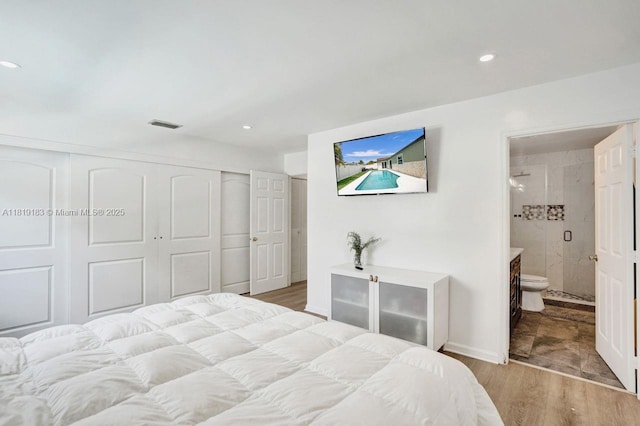 18998 Cloud Lake Cir, Boca Raton, FL 33496 - bedroom with a closet, wood finished floors, recessed lighting, and ensuite bathroom