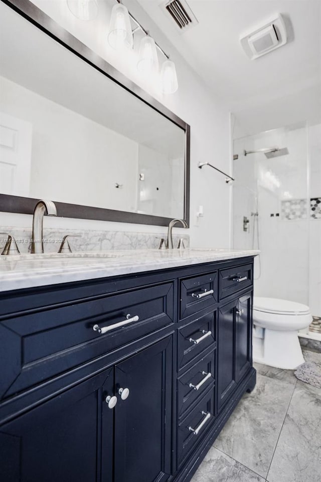18998 Cloud Lake Cir, Boca Raton, FL 33496 - bathroom with double vanity, marble finish floors, and a stall shower