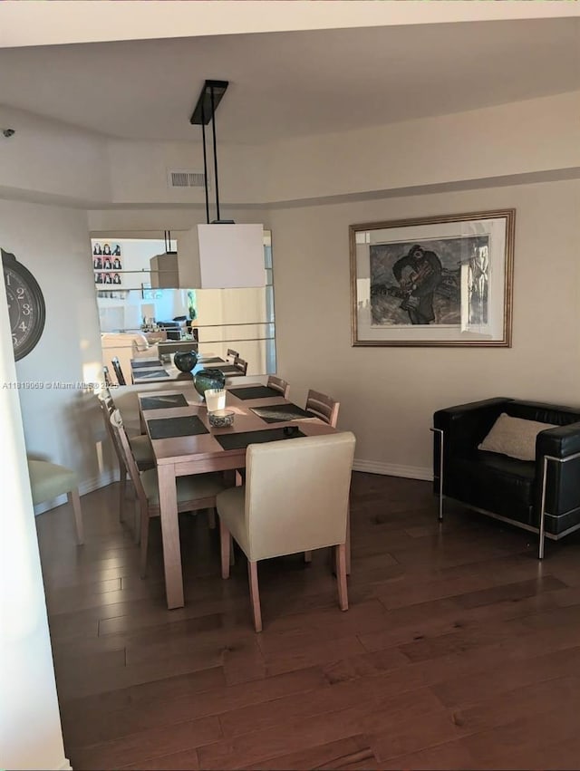 7400 Radice Ct Unit 402, Lauderhill, FL 33319 - dining area featuring dark wood finished floors and baseboards