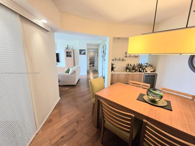7400 Radice Ct Unit 402, Lauderhill, FL 33319 - kitchen featuring beverage cooler, dark wood-style flooring, and light countertops