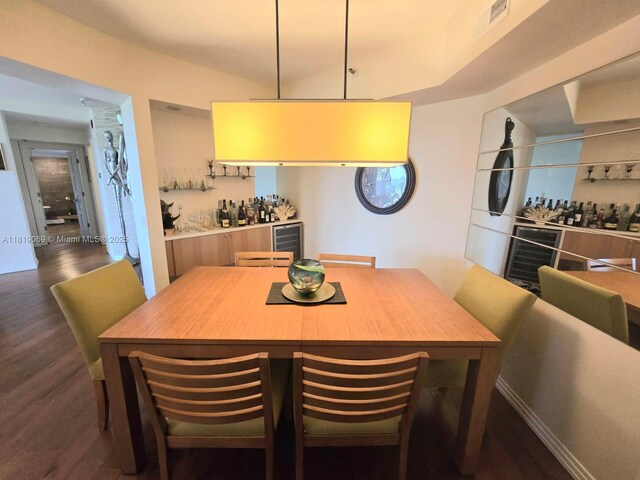 7400 Radice Ct Unit 402, Lauderhill, FL 33319 - dining room with wood finished floors, beverage cooler, and a bar