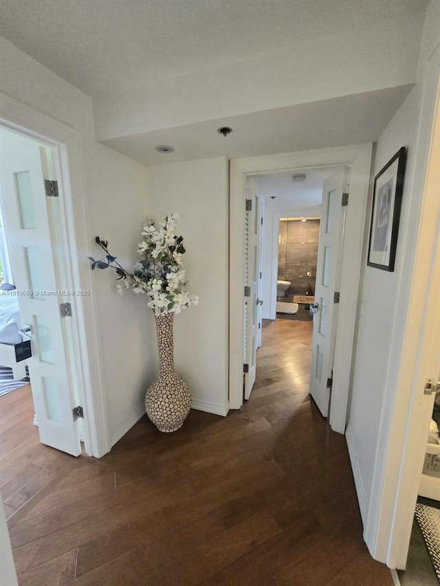 7400 Radice Ct Unit 402, Lauderhill, FL 33319 - corridor featuring baseboards and dark wood-style floors