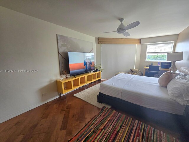 7400 Radice Ct Unit 402, Lauderhill, FL 33319 - bedroom with wood finished floors, a ceiling fan, and baseboards