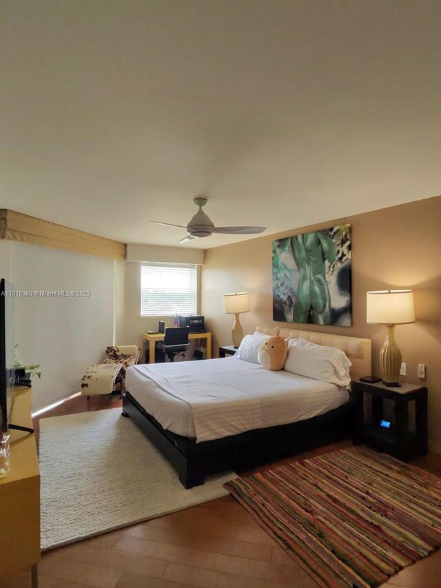 7400 Radice Ct Unit 402, Lauderhill, FL 33319 - bedroom with wood finished floors and ceiling fan