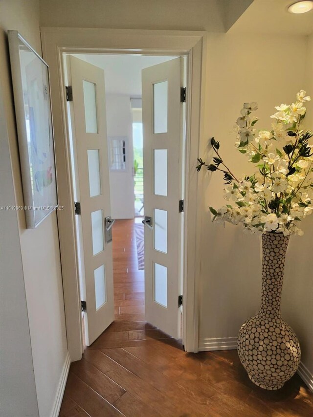 7400 Radice Ct Unit 402, Lauderhill, FL 33319 - hall with dark wood-style flooring and baseboards