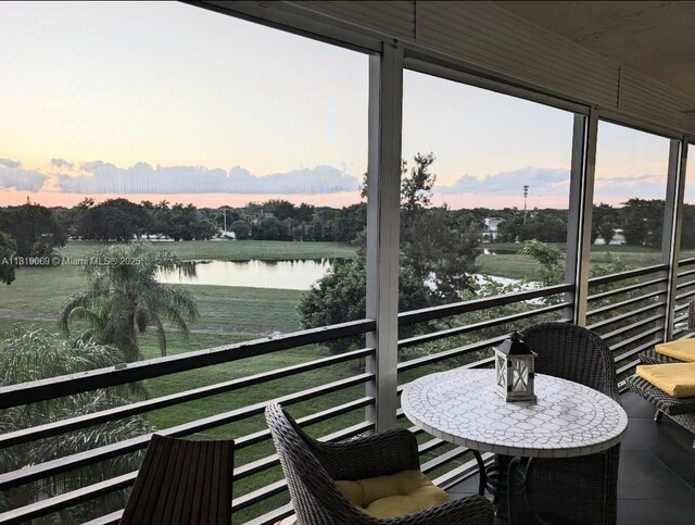 7400 Radice Ct Unit 402, Lauderhill, FL 33319 - sunroom featuring a water view