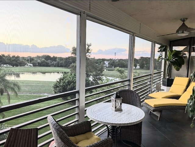 7400 Radice Ct Unit 402, Lauderhill, FL 33319 - sunroom / solarium with a water view, ceiling fan, and tile patterned flooring