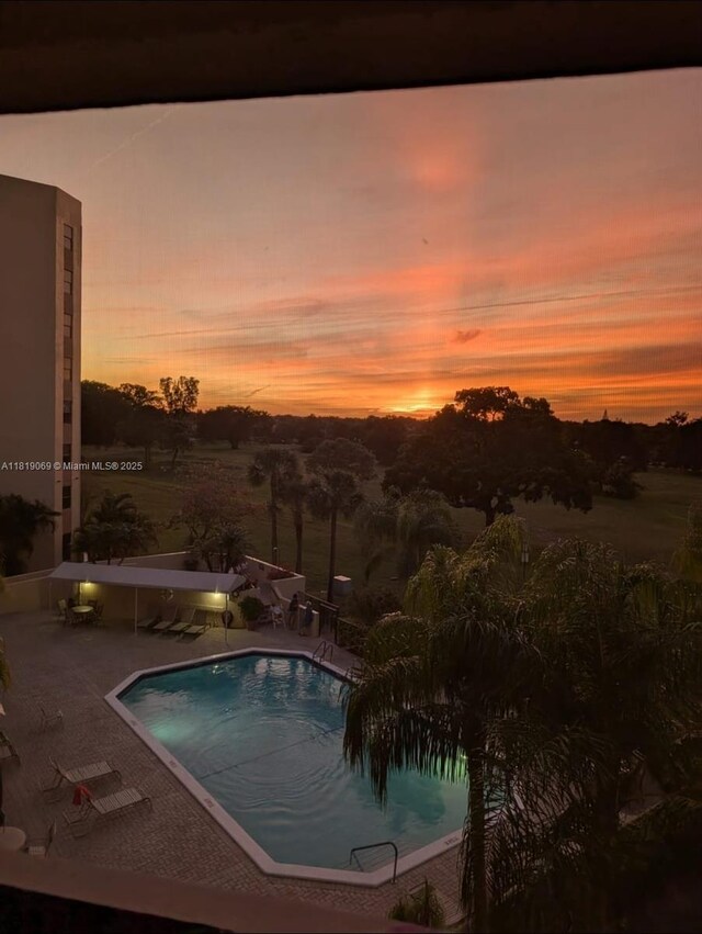 7400 Radice Ct Unit 402, Lauderhill, FL 33319 - community pool featuring a patio