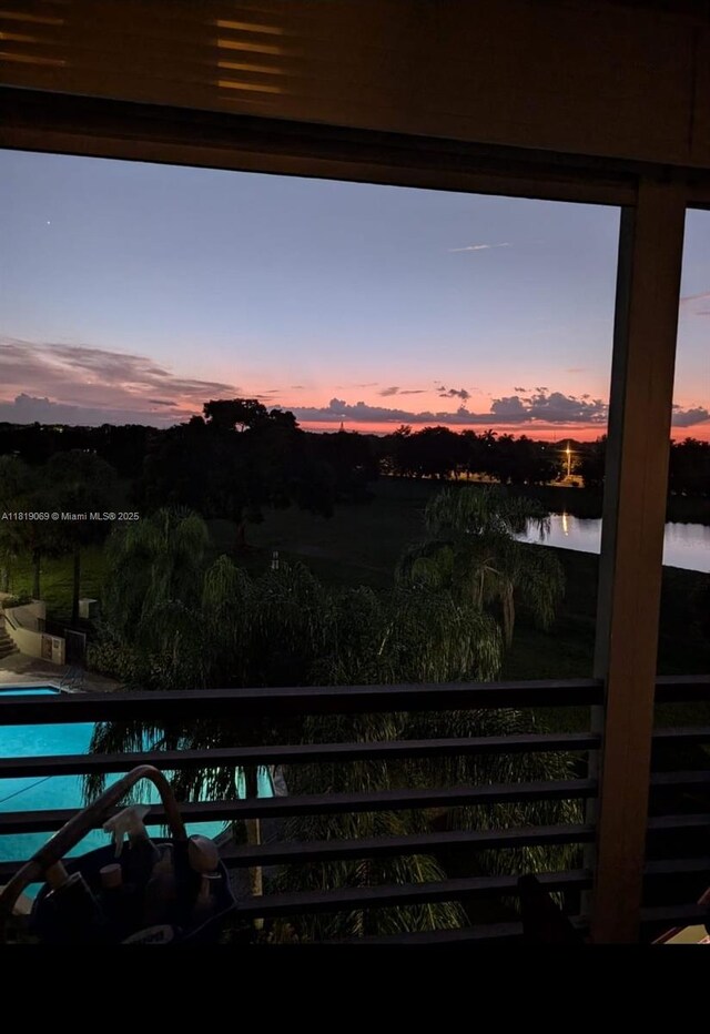 7400 Radice Ct Unit 402, Lauderhill, FL 33319 - balcony with a water view and view of pool area