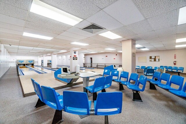 7400 Radice Ct Unit 402, Lauderhill, FL 33319 - game room with a drop ceiling, carpet floors, and bowling