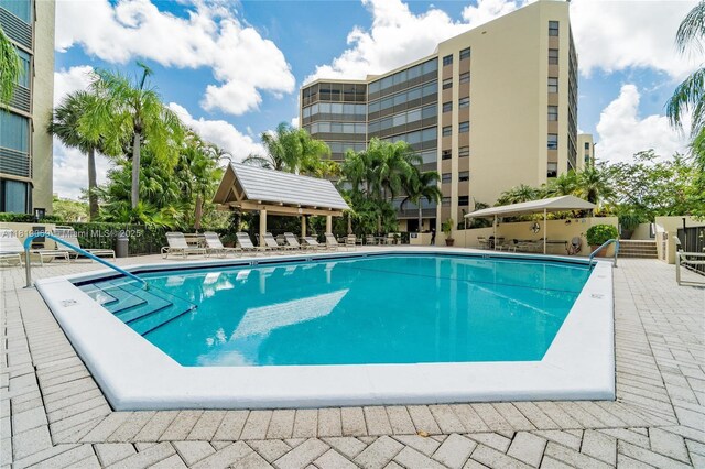 7400 Radice Ct Unit 402, Lauderhill, FL 33319 - community pool with a patio area