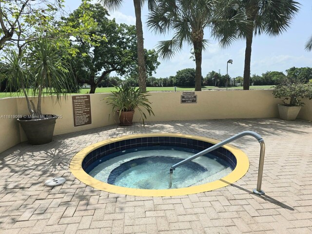 7400 Radice Ct Unit 402, Lauderhill, FL 33319 - view of pool featuring a community hot tub