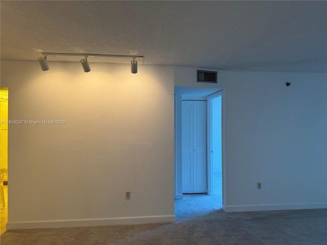 1100 Saint Charles Pl Unit 203, Pembroke Pines, FL 33026 - unfurnished room with track lighting, carpet, and baseboards