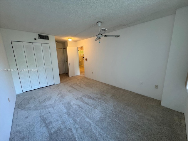 1100 Saint Charles Pl Unit 203, Pembroke Pines, FL 33026 - unfurnished bedroom featuring carpet flooring and a textured ceiling