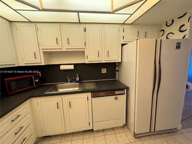1100 Saint Charles Pl Unit 203, Pembroke Pines, FL 33026 - kitchen featuring white appliances, dark countertops, and a sink