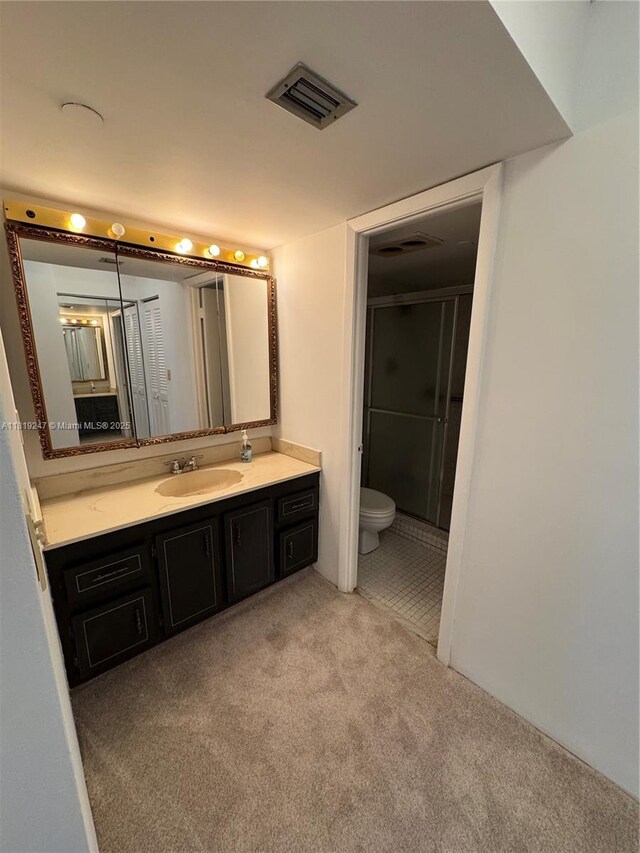1100 Saint Charles Pl Unit 203, Pembroke Pines, FL 33026 - bathroom with carpet floors, vanity, a stall shower, and toilet