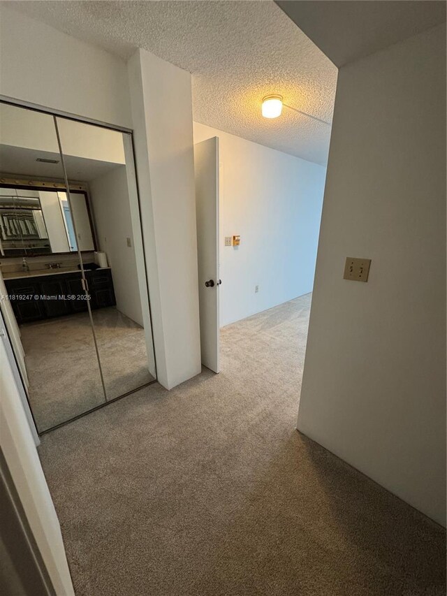 1100 Saint Charles Pl Unit 203, Pembroke Pines, FL 33026 - corridor with carpet floors and a textured ceiling