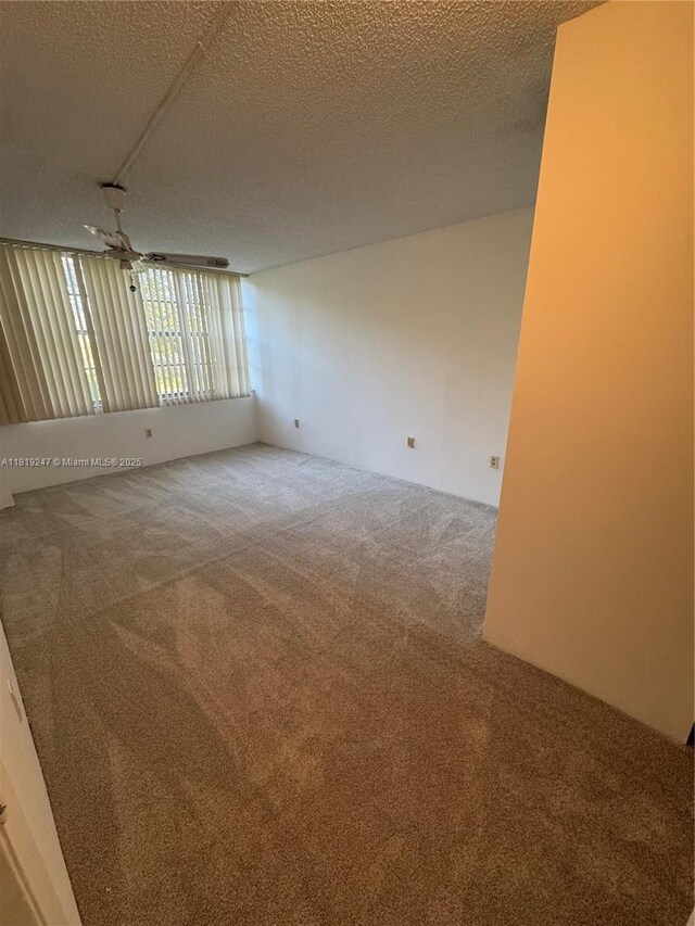 1100 Saint Charles Pl Unit 203, Pembroke Pines, FL 33026 - empty room featuring carpet flooring and ceiling fan