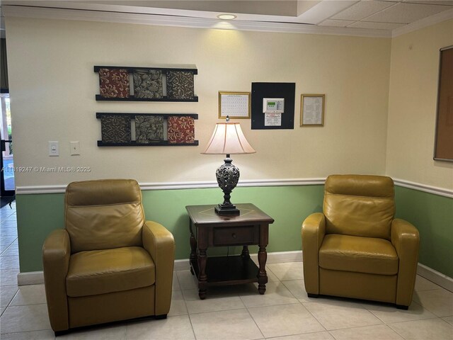1100 Saint Charles Pl Unit 203, Pembroke Pines, FL 33026 - living area with ornamental molding, baseboards, and light tile patterned floors
