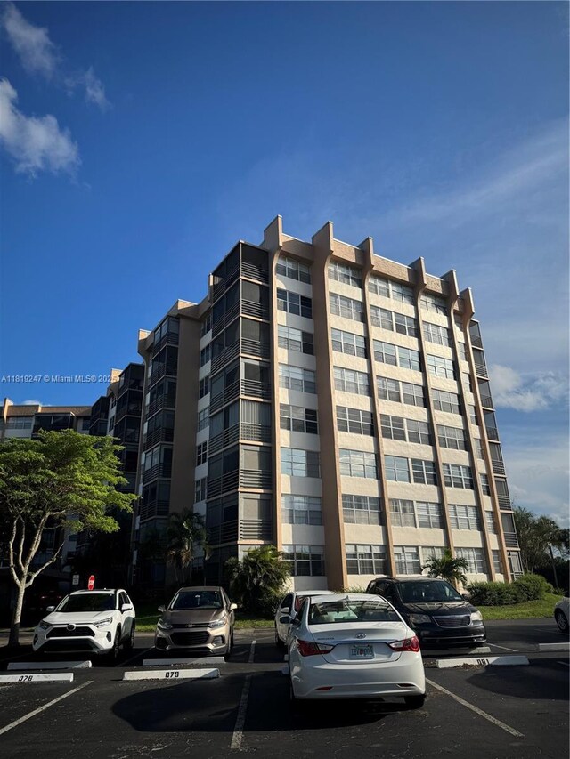 1100 Saint Charles Pl Unit 203, Pembroke Pines, FL 33026 - view of apartment building / complex featuring uncovered parking