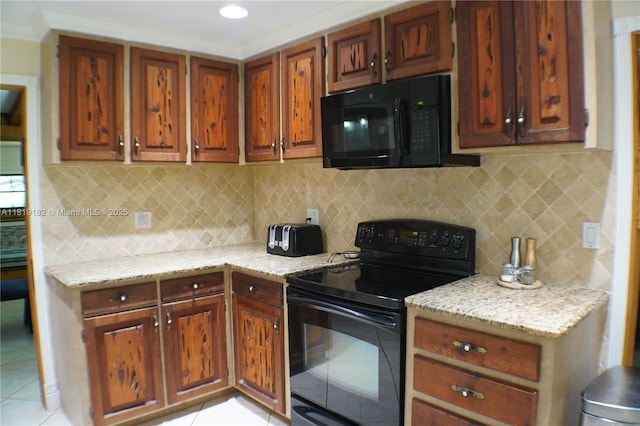 14360 SW 20th St, Davie, FL 33325 - kitchen featuring black appliances, light tile patterned floors, light stone countertops, ornamental molding, and recessed lighting