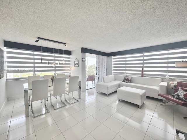 2741 Taft St Unit 410, Hollywood, FL 33020 - tiled living area with track lighting, plenty of natural light, and a textured ceiling