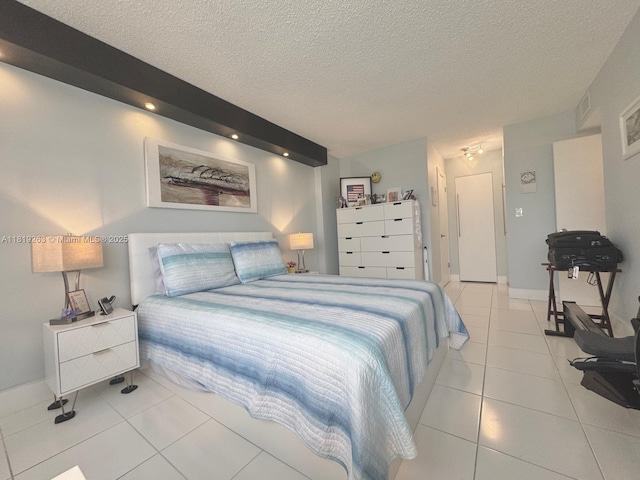 2741 Taft St Unit 410, Hollywood, FL 33020 - tiled bedroom featuring a textured ceiling