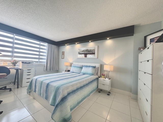 2741 Taft St Unit 410, Hollywood, FL 33020 - bedroom with a textured ceiling and light tile patterned floors