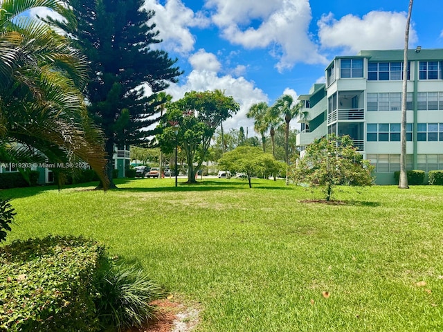2741 Taft St Unit 410, Hollywood, FL 33020 - surrounding community with a lawn