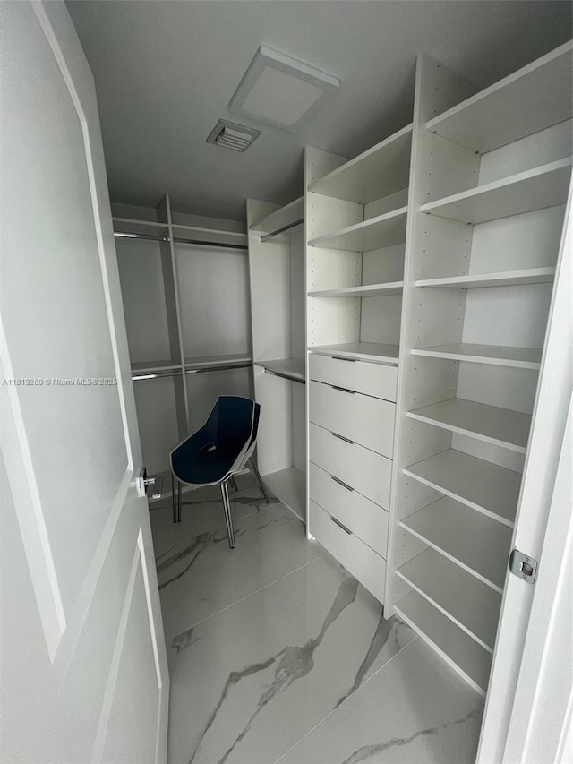7350 SW 89th St Unit 2011S, Miami, FL 33156 - walk in closet featuring light marble finish flooring