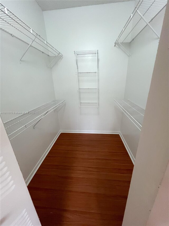 1881 NW 96th Ter Unit 7C, Pembroke Pines, FL 33024 - spacious closet featuring wood finished floors