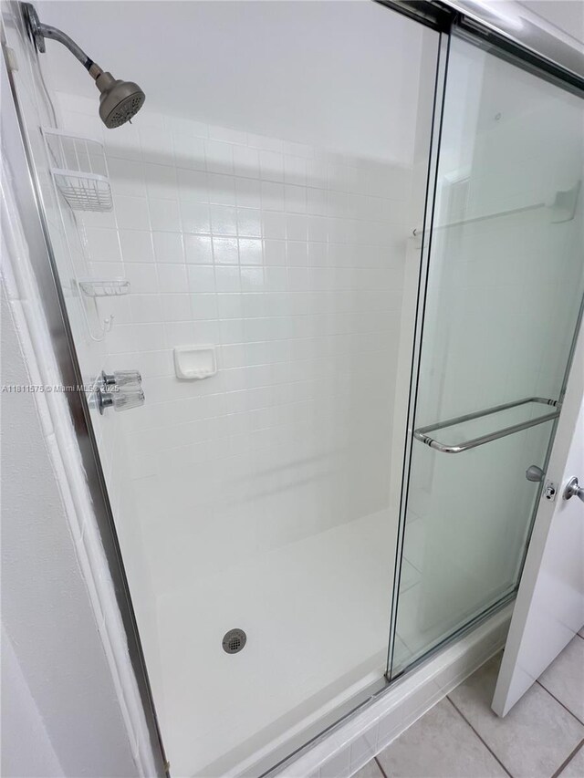 1881 NW 96th Ter Unit 7C, Pembroke Pines, FL 33024 - full bathroom featuring a stall shower and tile patterned floors