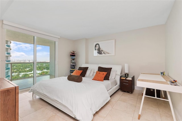 2101 Brickell Ave Unit 2409, Miami, FL 33129 - bedroom featuring access to exterior and baseboards