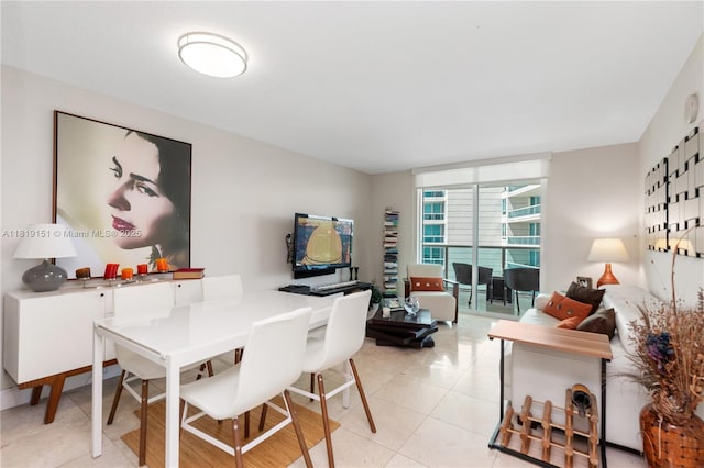 2101 Brickell Ave Unit 2409, Miami, FL 33129 - dining room with light tile patterned floors and expansive windows