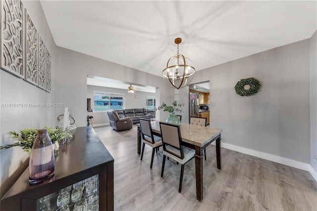 8331 NW 18th St, Pembroke Pines, FL 33024 - dining room featuring a chandelier, wood finished floors, and a ceiling fan